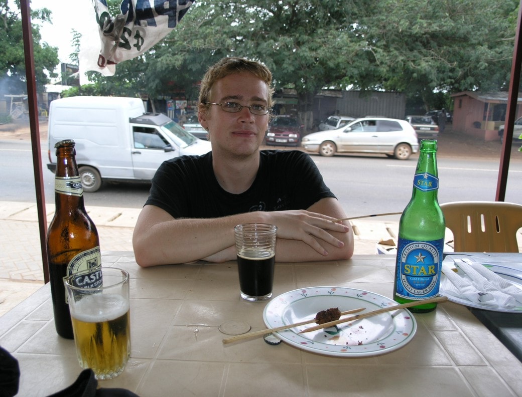 Jon with Castle beer at lunch in Accra
