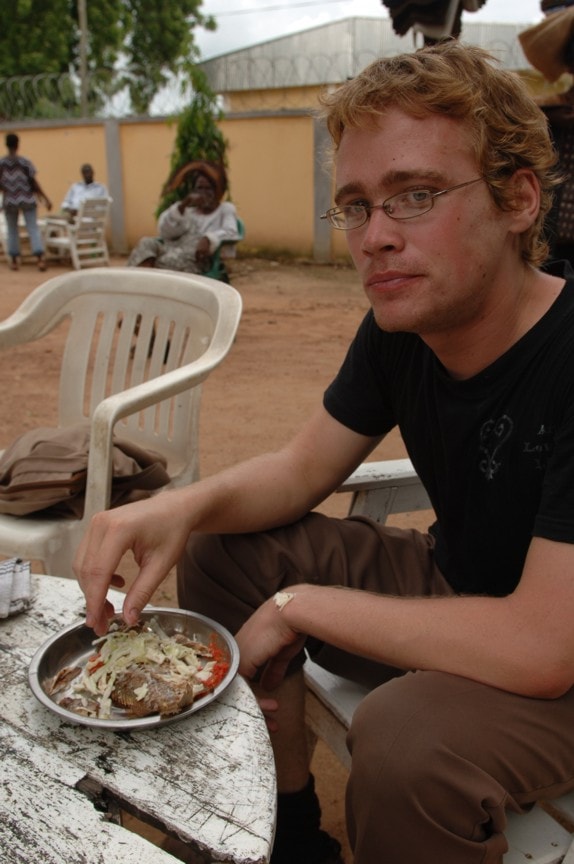 Jon eating fish in Navrongo