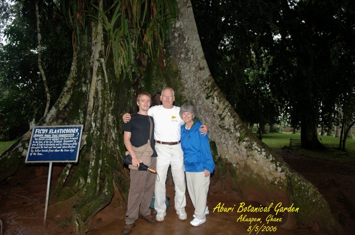 Jon, Ken, and Kathleen in front of giant hollow tree at Aburi Botanical Garden