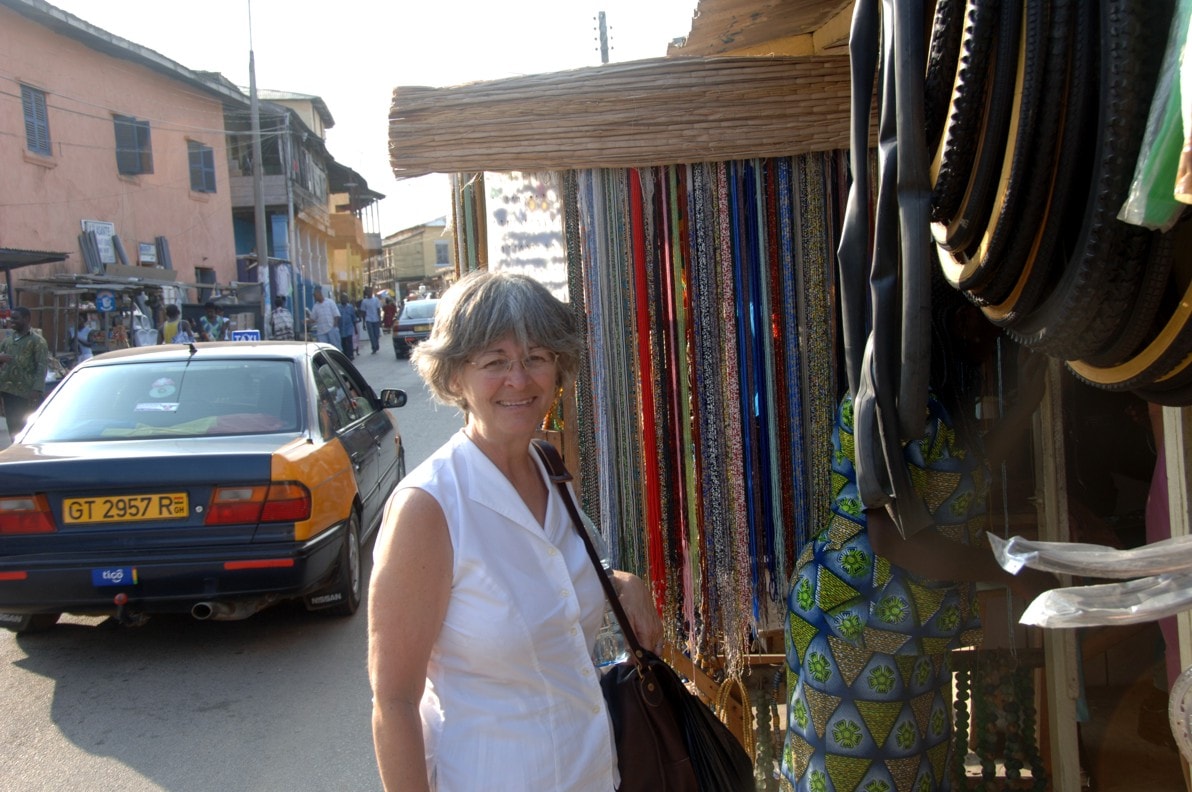 Kathleen browsing a street market stall in Cape Coast