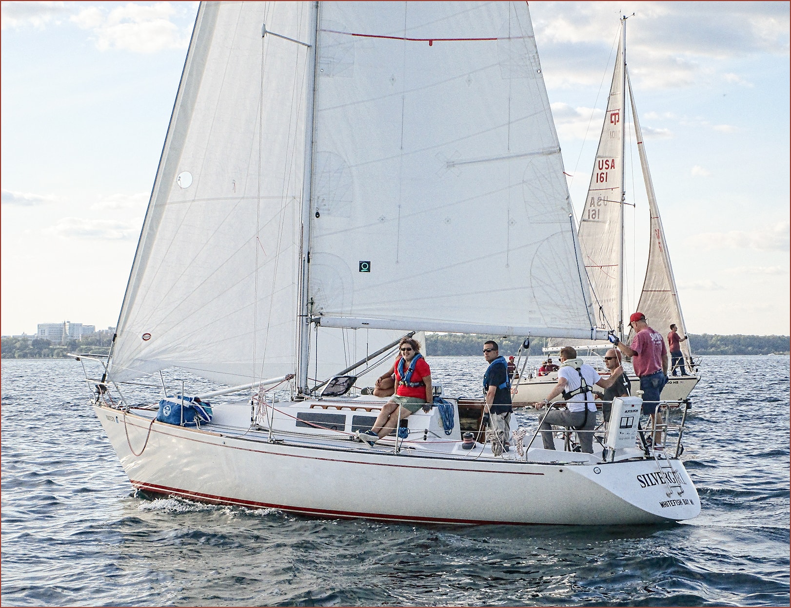 Silver Girl Whitefish Bay close-up with crew