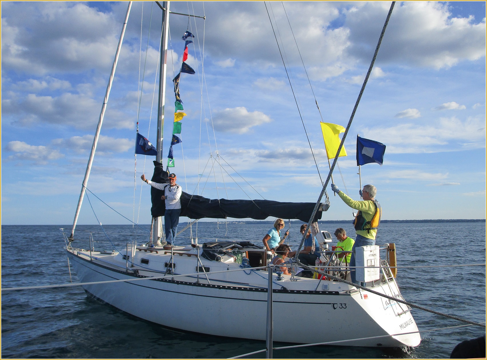 Lady Ayr as committee boat flags flying crew raising signals