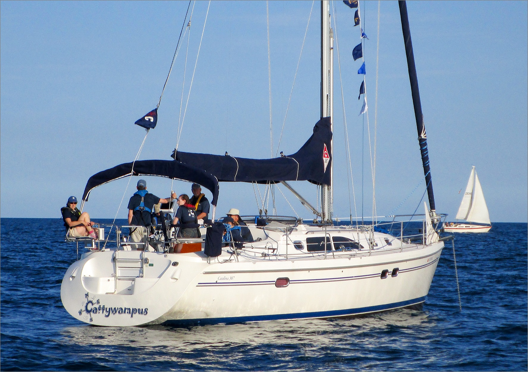 Cattywampus Catalina 387 flags flying committee boat