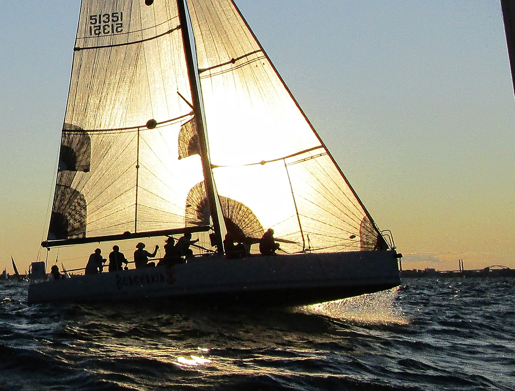 Dramatic sunset silhouette spinnaker backlit