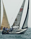 Racing yacht heeling hard in the wind during Friday night racing